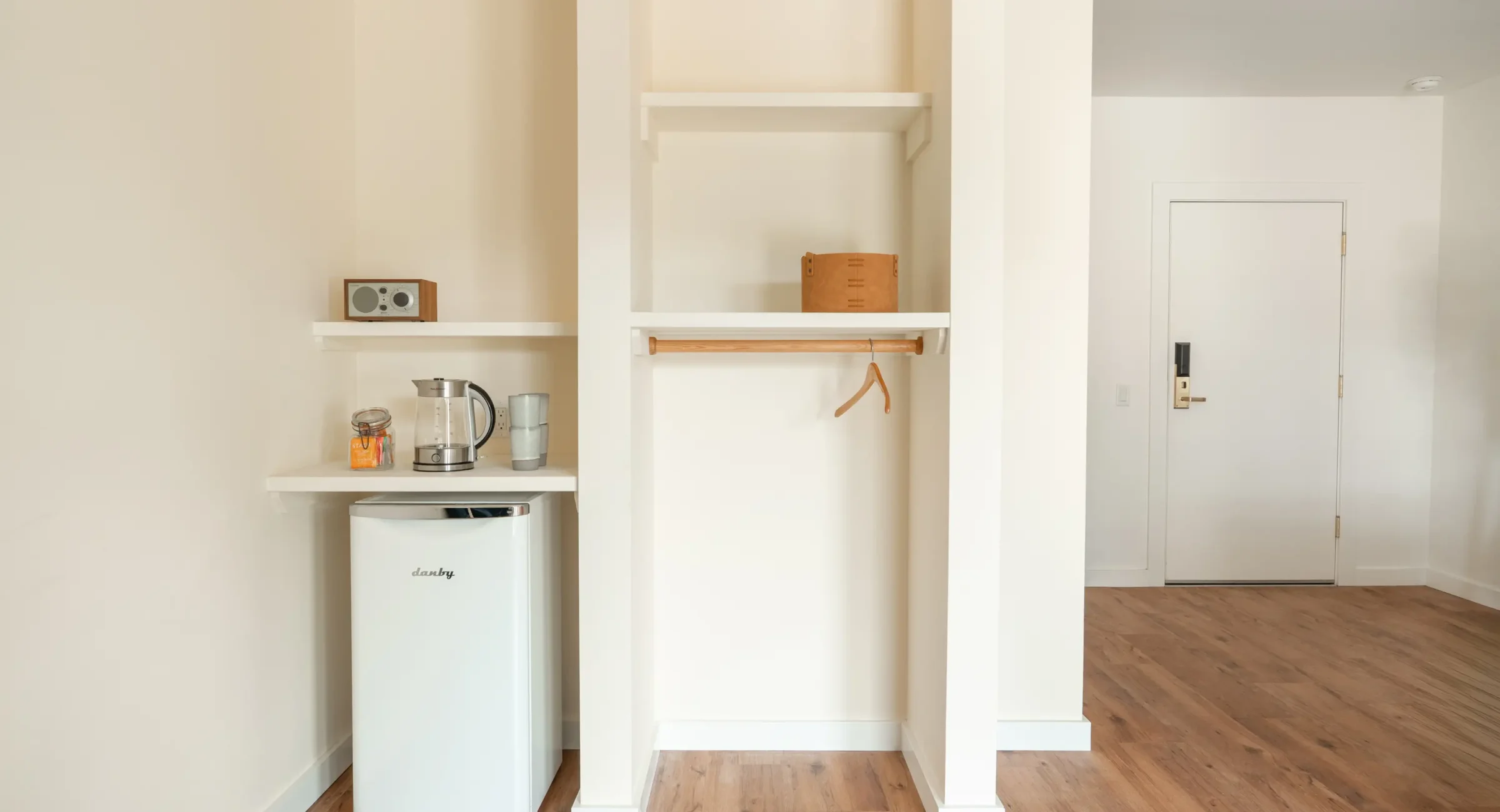 Accessible Mendocino resort accommodations with king bed, mini fridge, and open storage