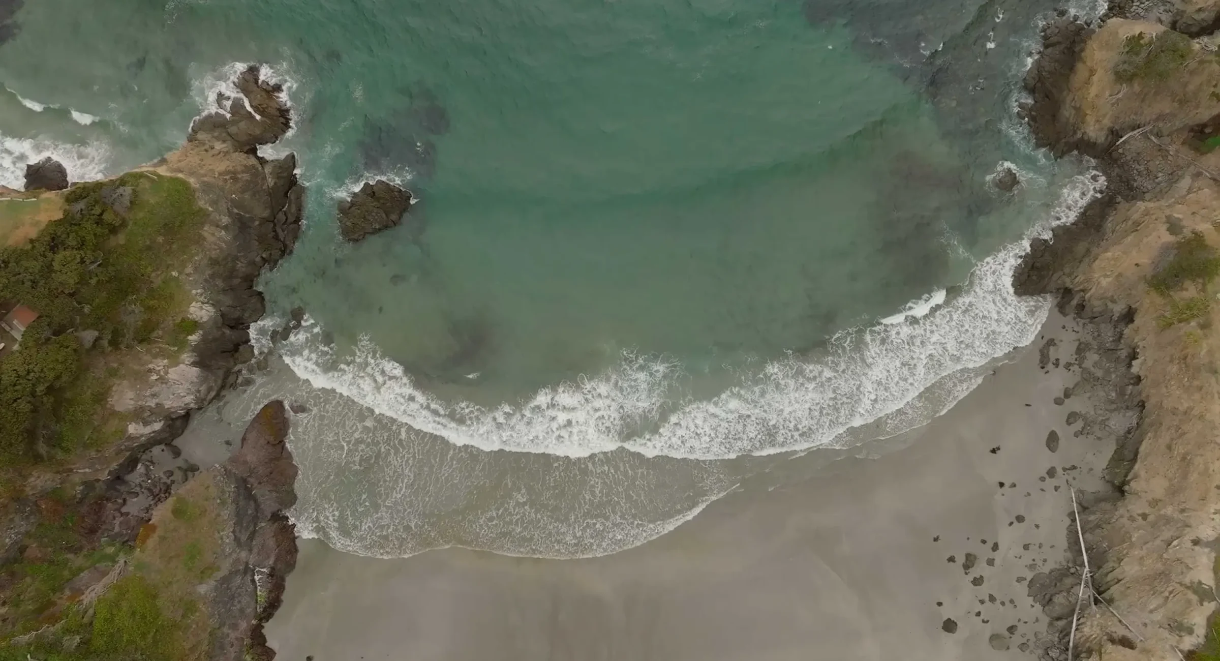 Aerial view of Pacific Ocean waves on Mendocino Coast beach near Mendocino, CA hotel