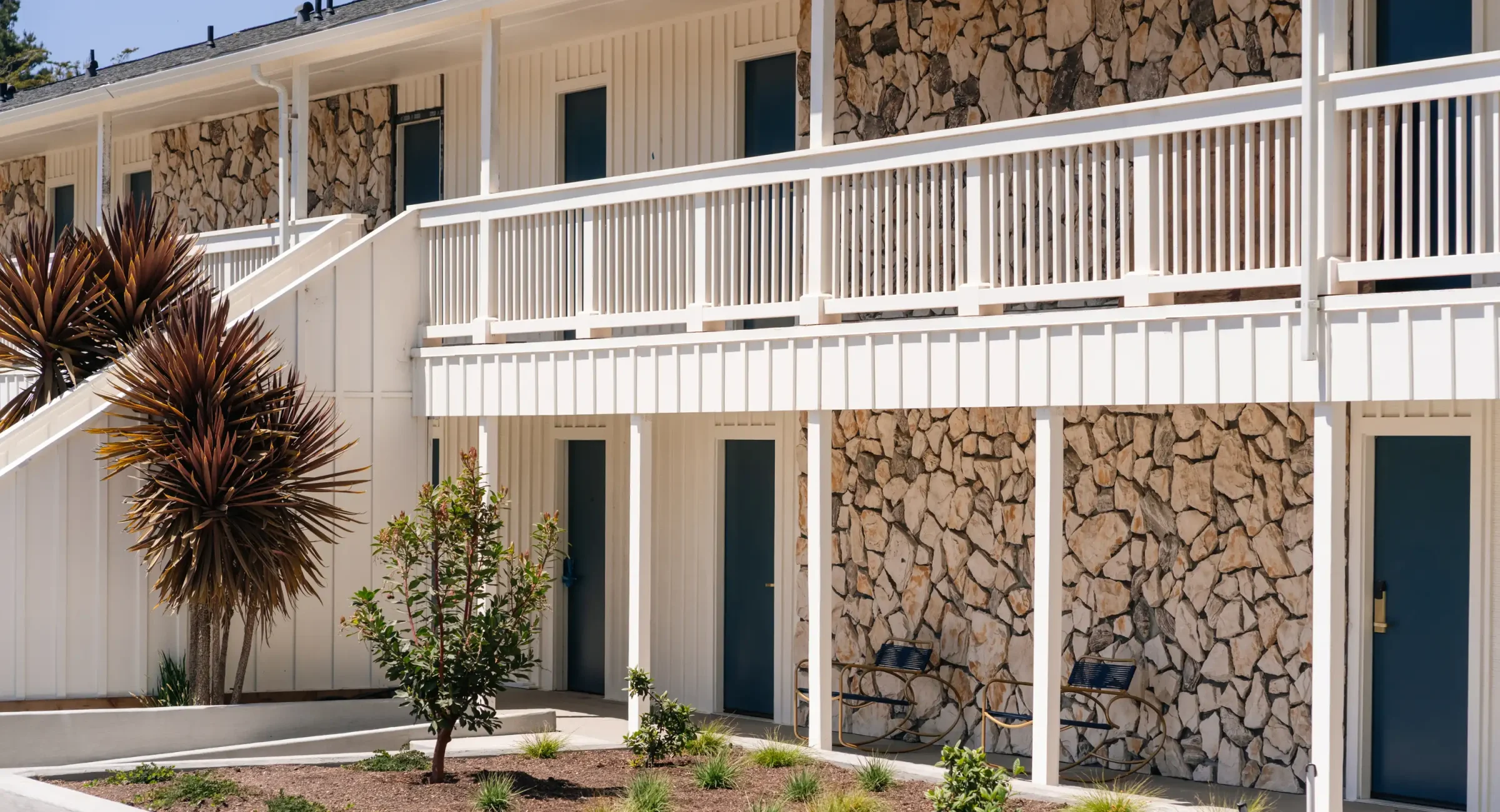 Hotel exterior with landscaped grounds at Fort Bragg hotel in Northern California
