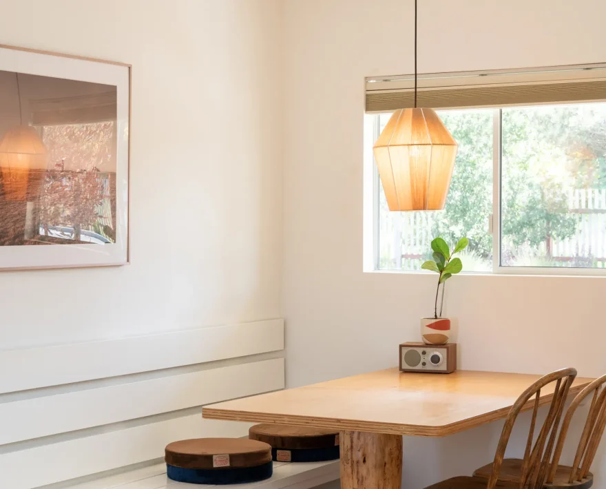 dining nook in Mendocino Coast resort king room with window light and table decor