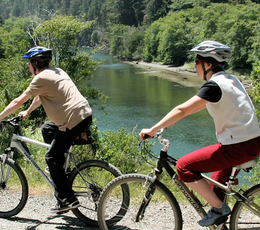 Couple biking along Big River trail