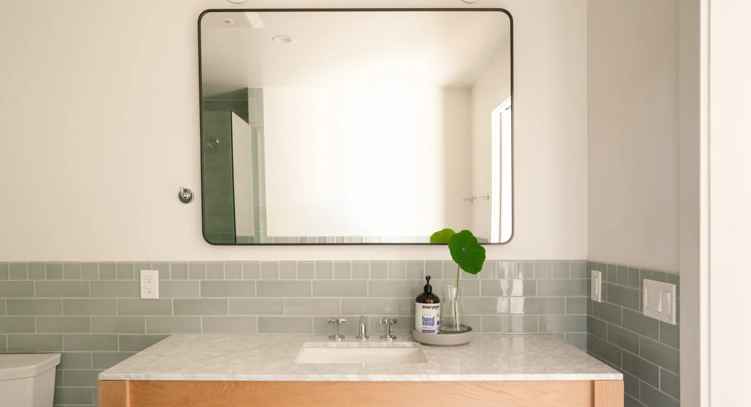 Modern vanity sink with wood counter in Mendocino lodging