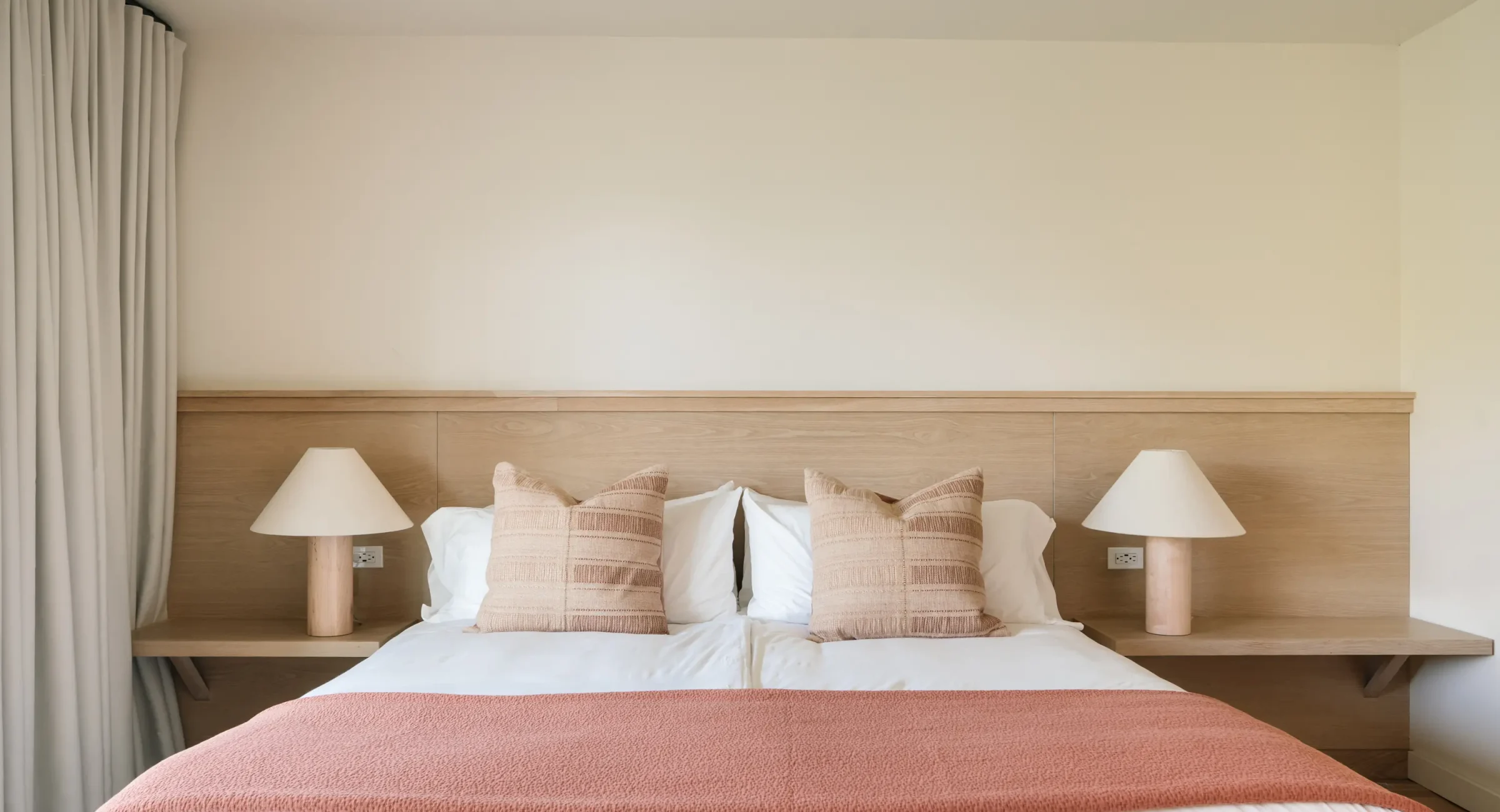 King bed with natural wood decor Mendocino Coast hotel