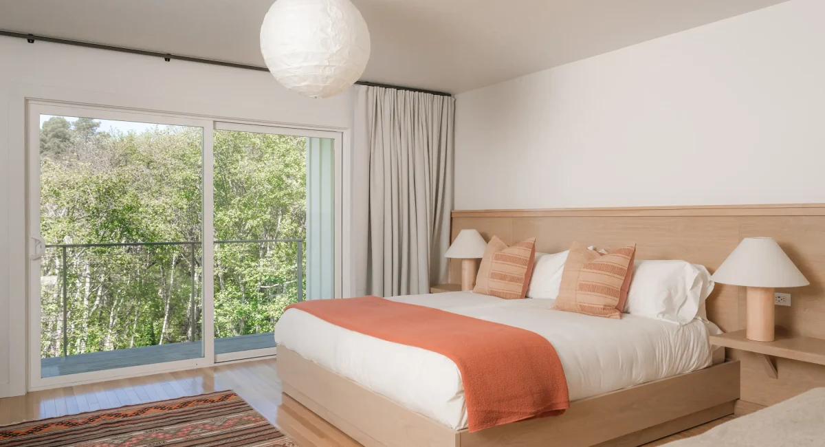 Modern guest room with private deck at top oceanfront Mendocino lodging