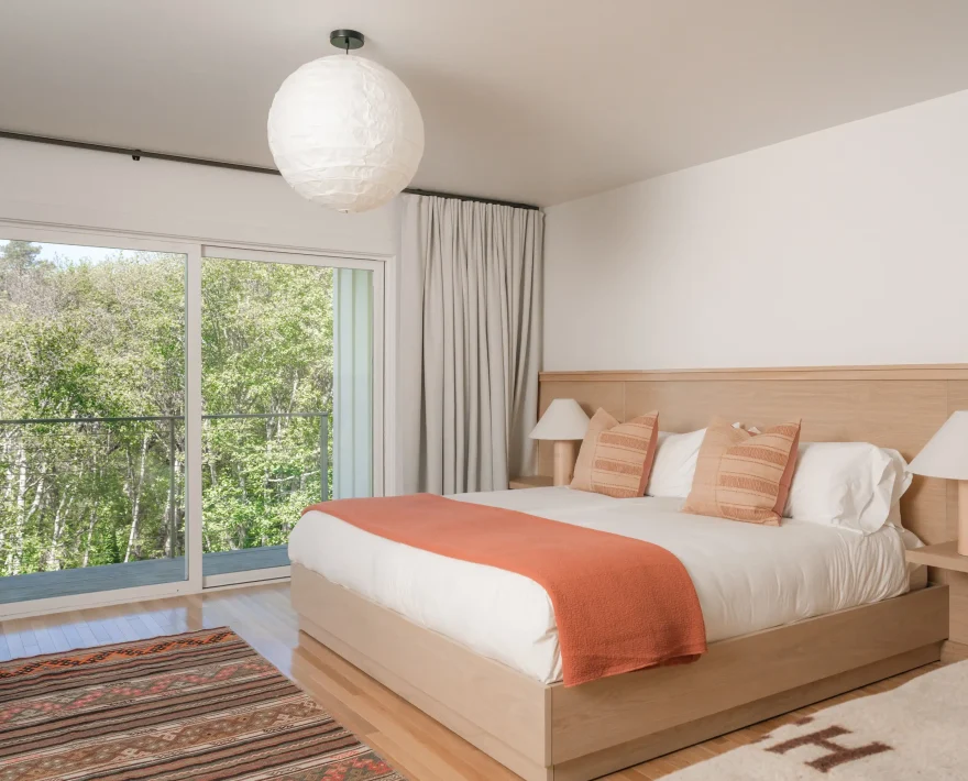 Modern guest room with private deck at top oceanfront Mendocino lodging