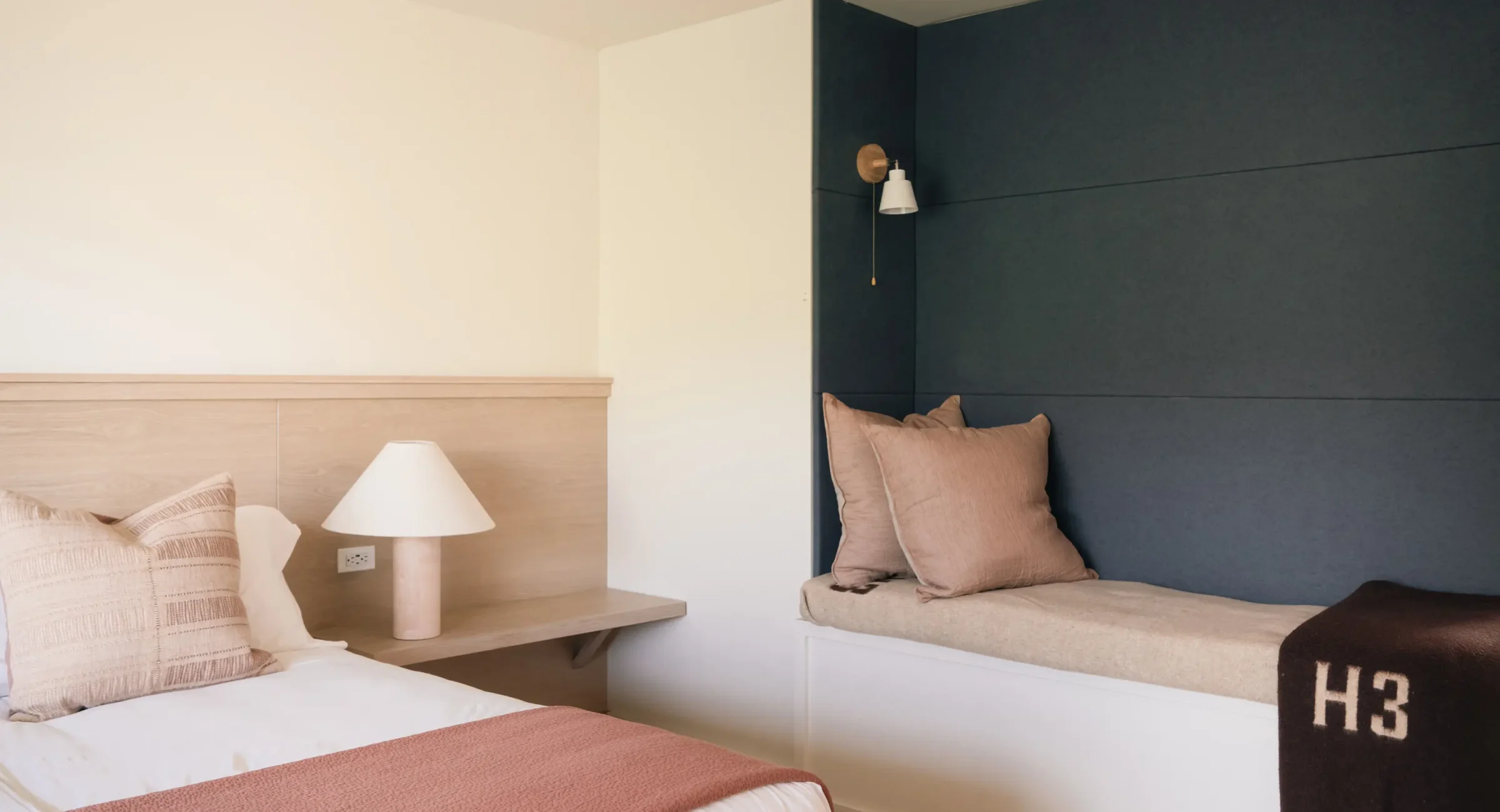Modern guest room with king bed and seating nook Mendocino Coast resort