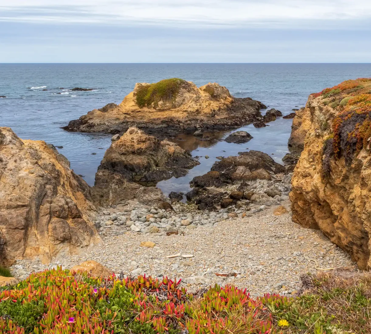 Rocky cliffs and ocean tide pools along the shoreline at MacKerricher State Park on the Mendocino Coast